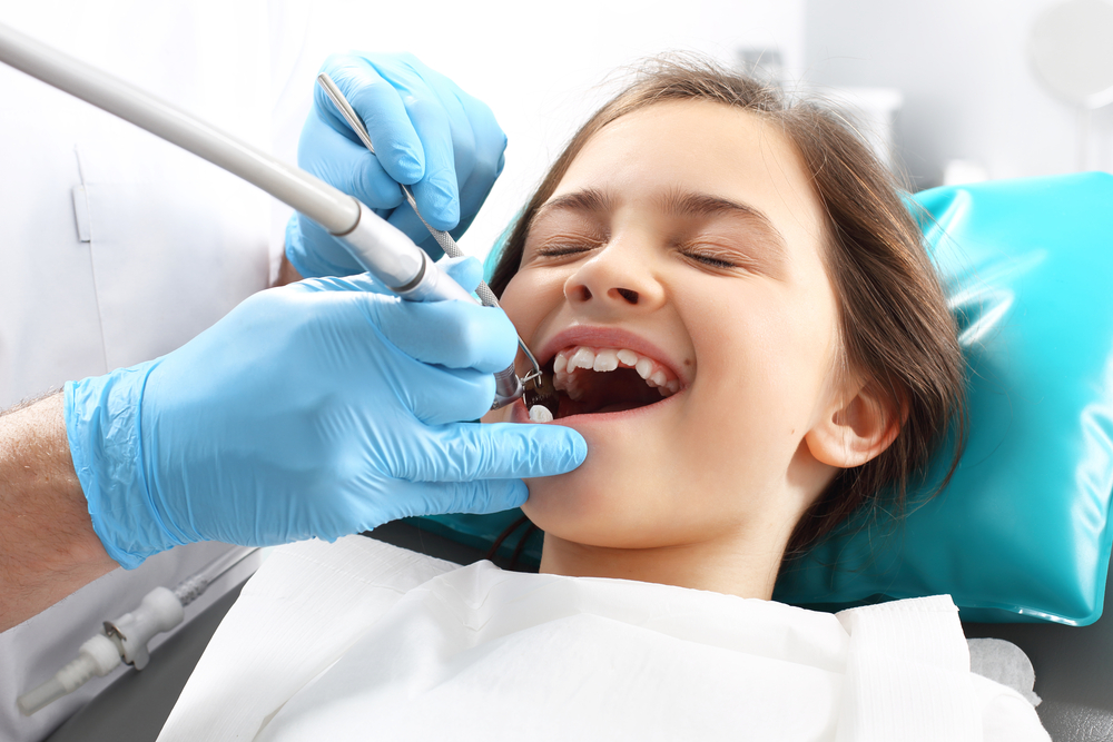 Close-up of molars with dental sealants applied in an Arlington dental office — preventive dentistry for children, teens, and adults.
