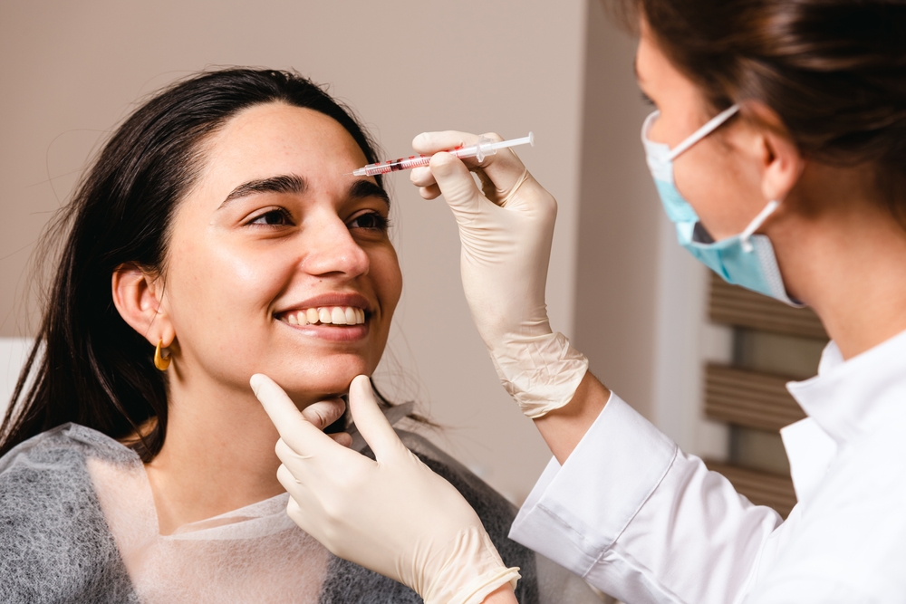 A,Doctor,Gives,Botox,Injections,To,Prevent,Wrinkles,On,The A,Doctor,Gives,Botox,Injections,To,Prevent,Wrinkles,On,The